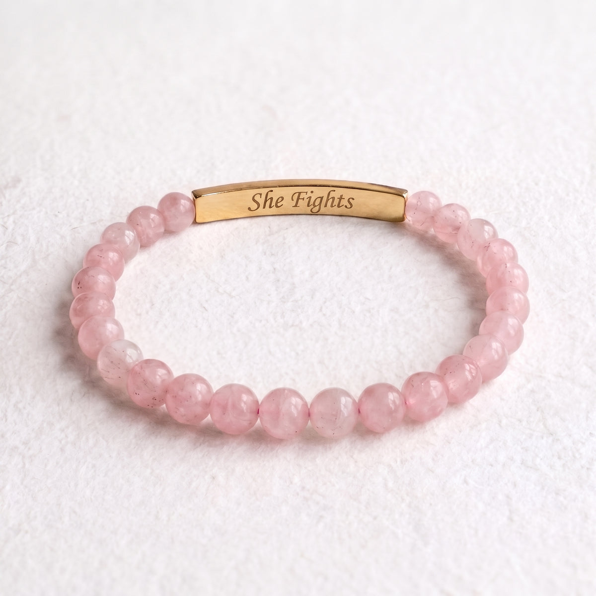 Armband zum Brustkrebsmonat – Sie kämpft