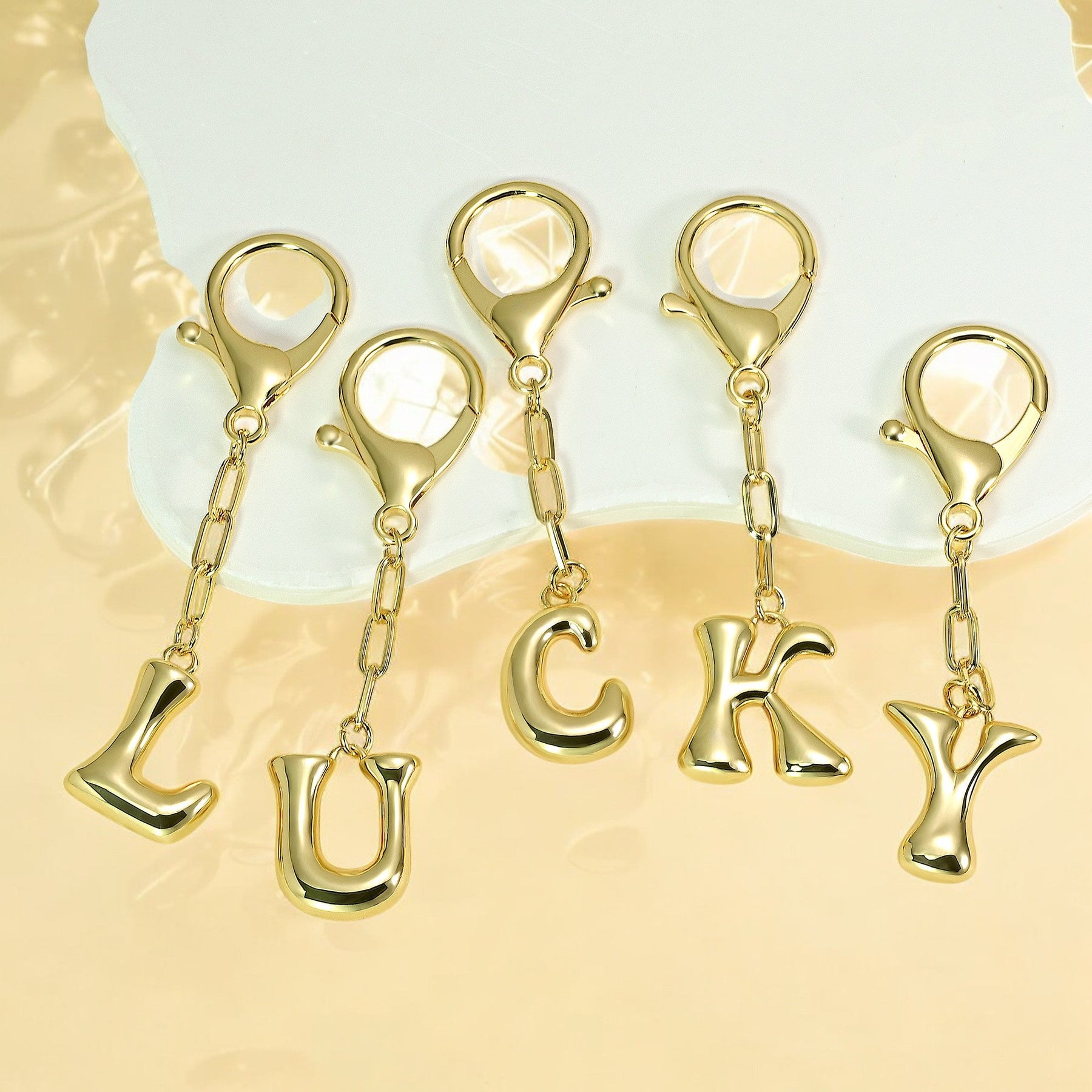 Porte-clés initial lettre bulle et charme de sac
