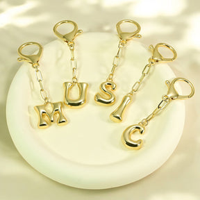 Porte-clés initial lettre bulle et charme de sac