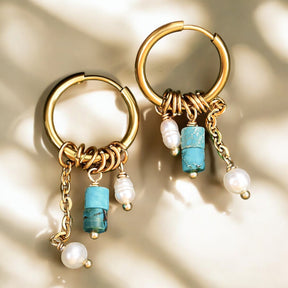 Boucles d'oreilles créoles en forme de goutte avec fleurs dorées